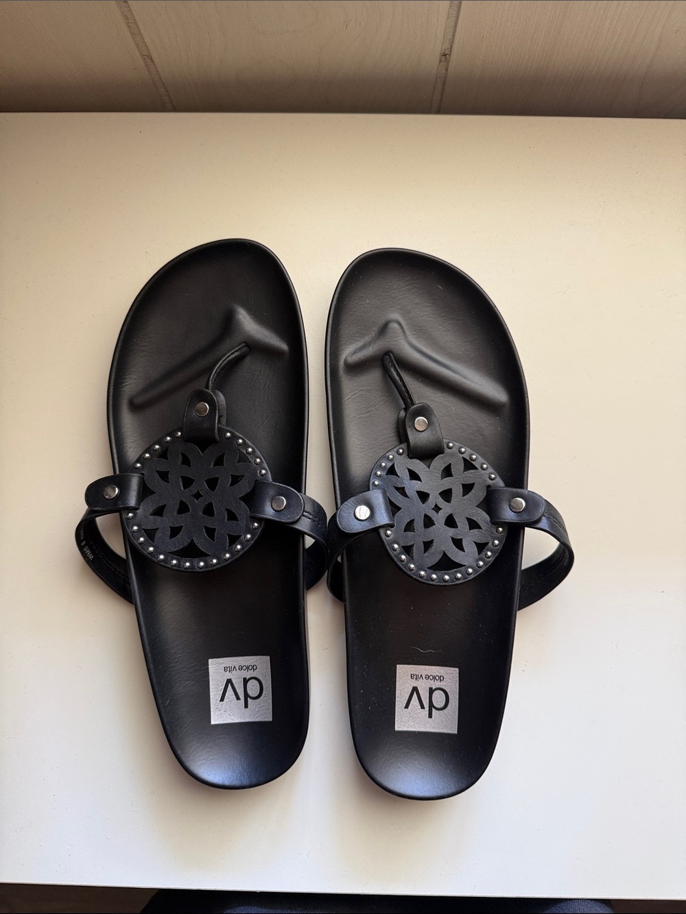 Dolce Vita black leather-look floral medallion sandals